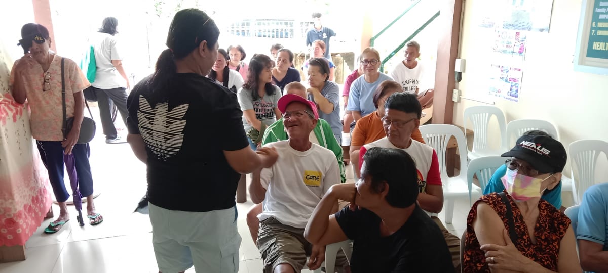 Community members attending the medical mission at Bagbaguin Health Center